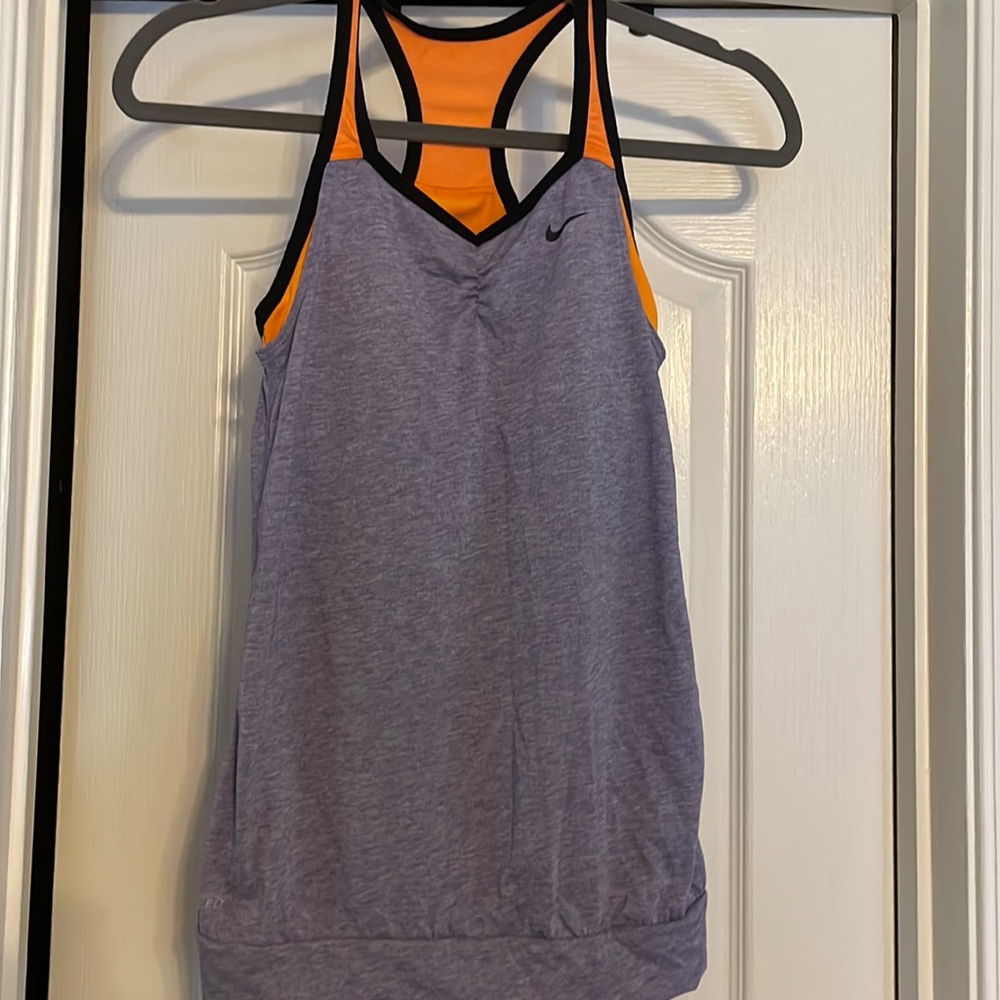 Nike woman’s dri fit workout tank size xl but fits more like a medium